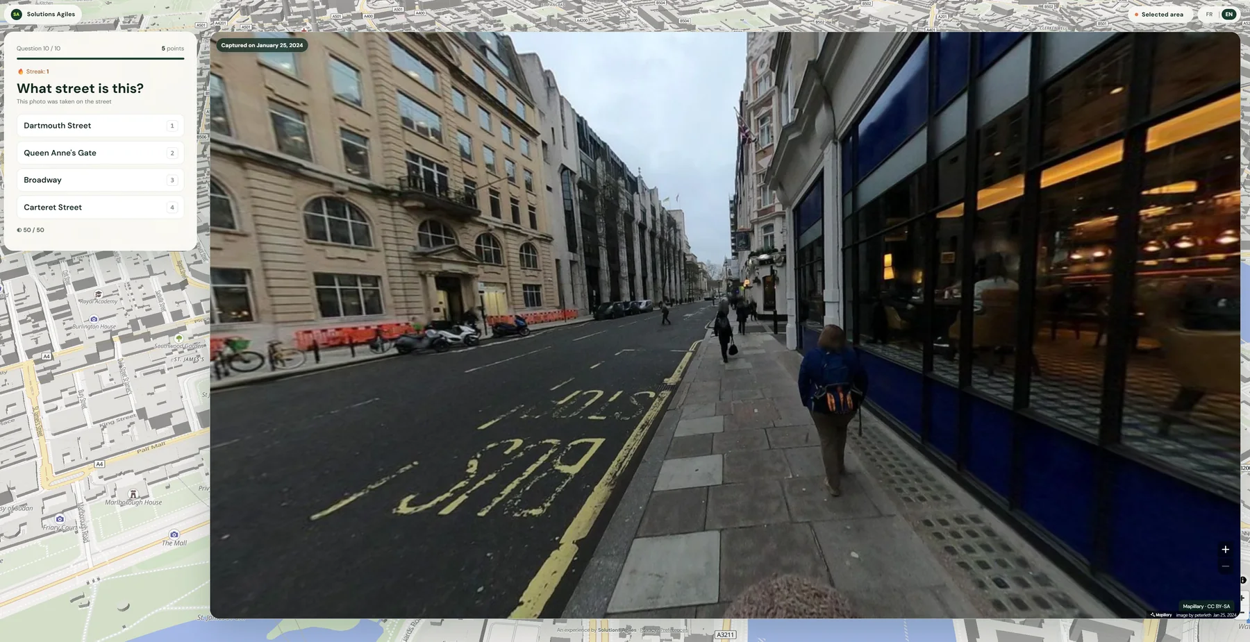 London photo quiz view showing architecture, traffic markings and streetscape clues